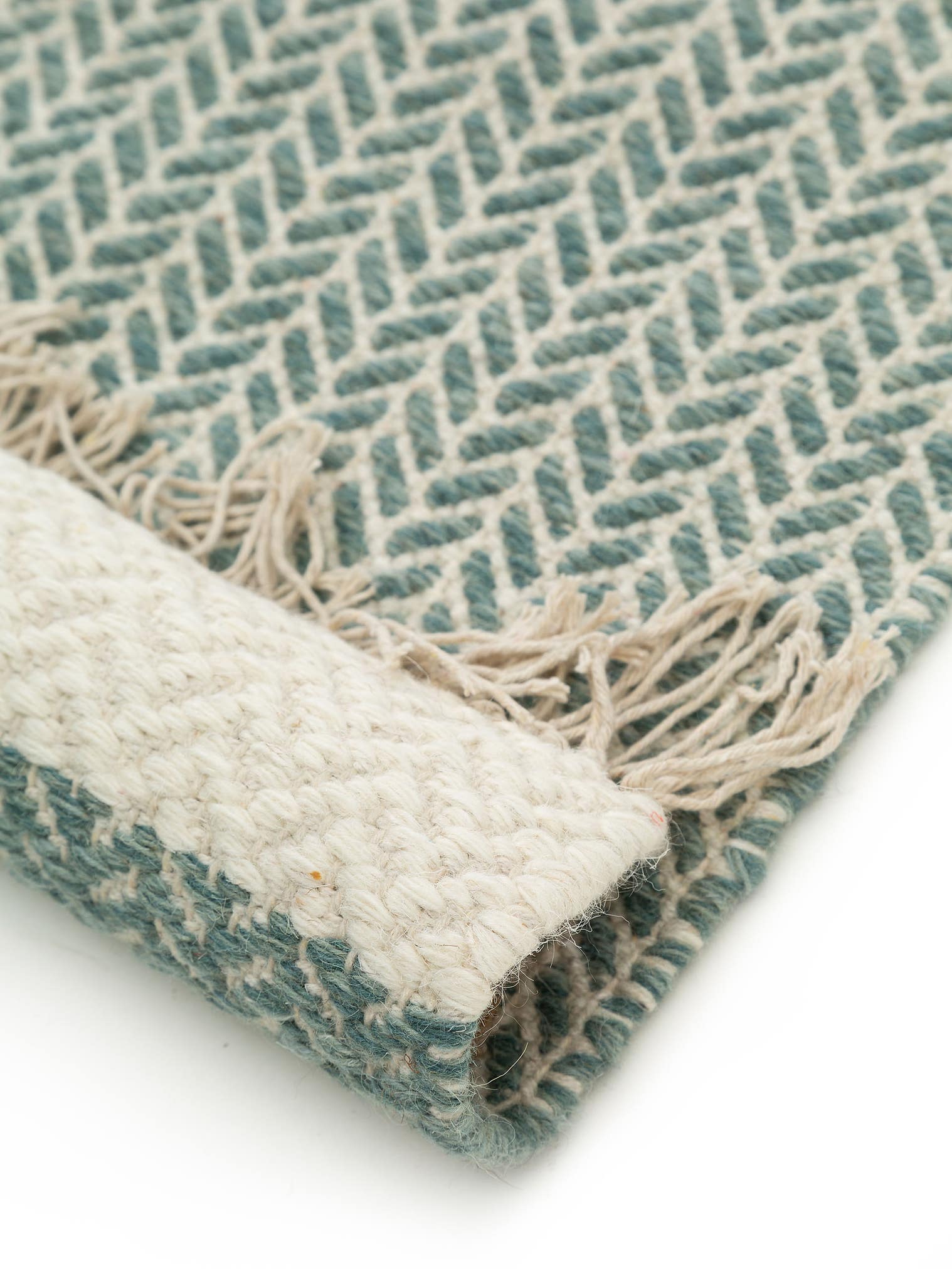 Teppich aus 60% Wolle, 40% Baumwolle in Grün mit bis 5 mm hohem Flor von benuta Pure
