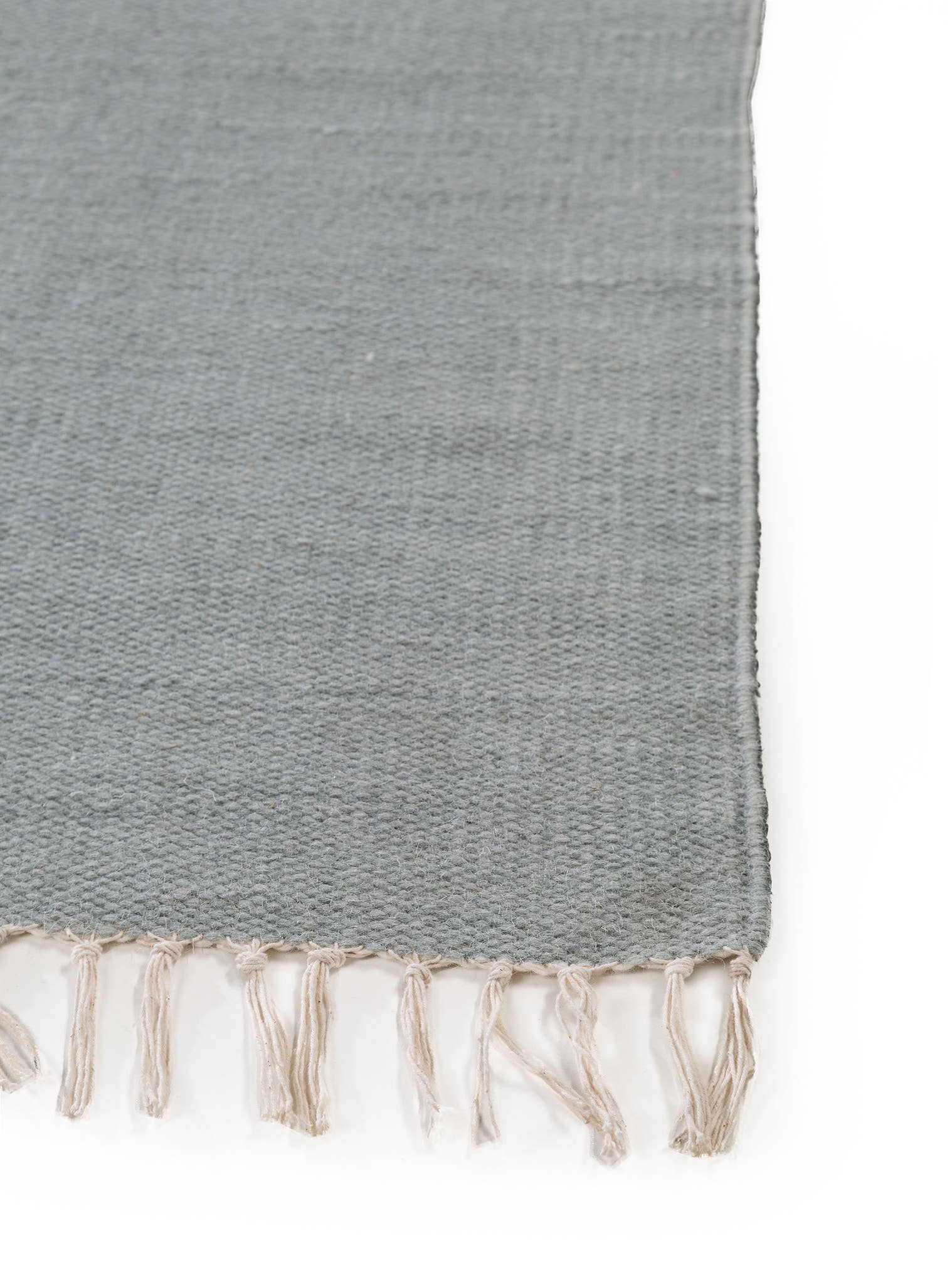 Teppich aus 100% Wolle in Grün mit bis 5 mm hohem Flor von benuta Pop