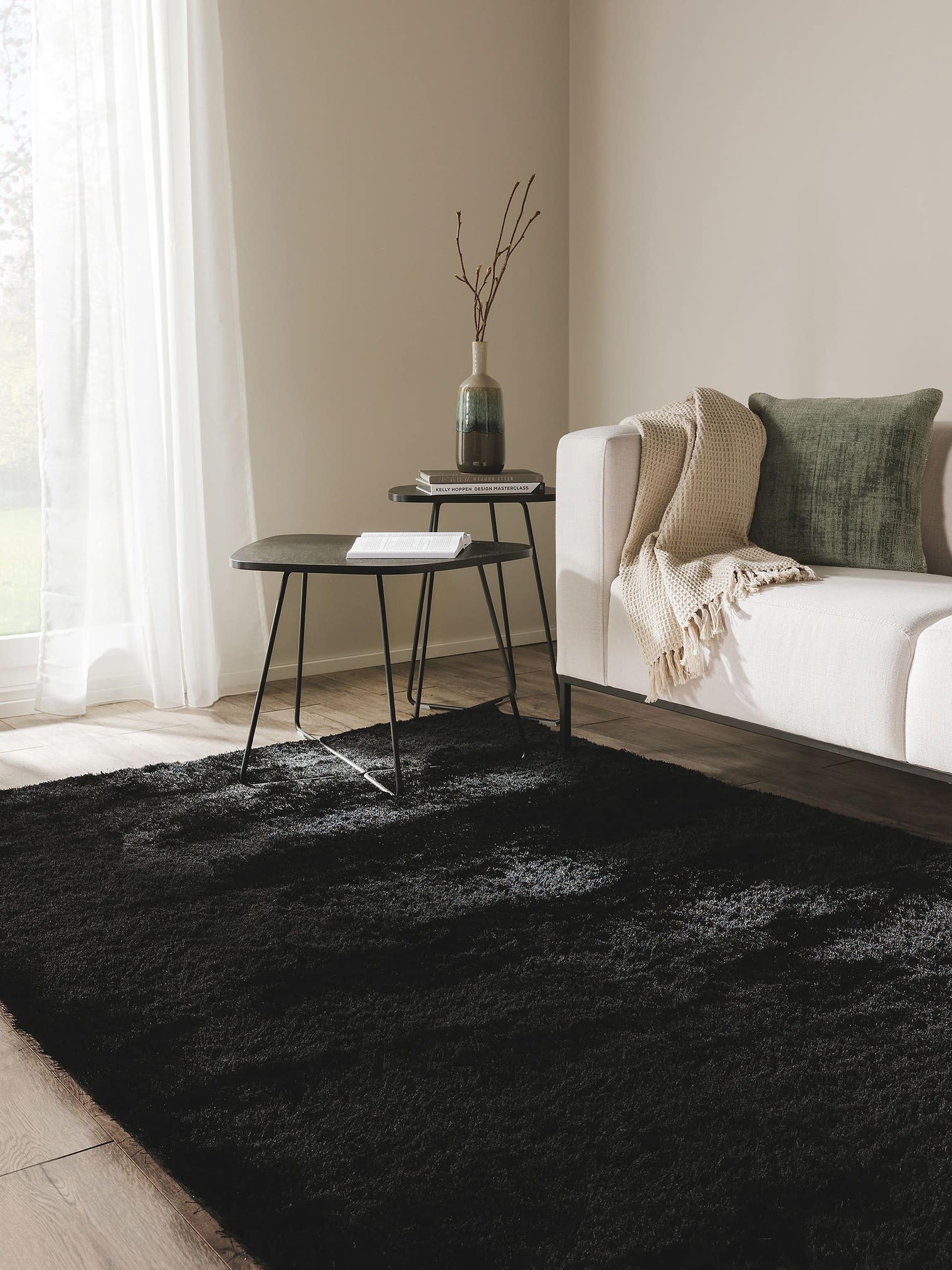 Rug made of 100% Polyester in Black with a 31 - 40 mm high pile by benuta Nest
