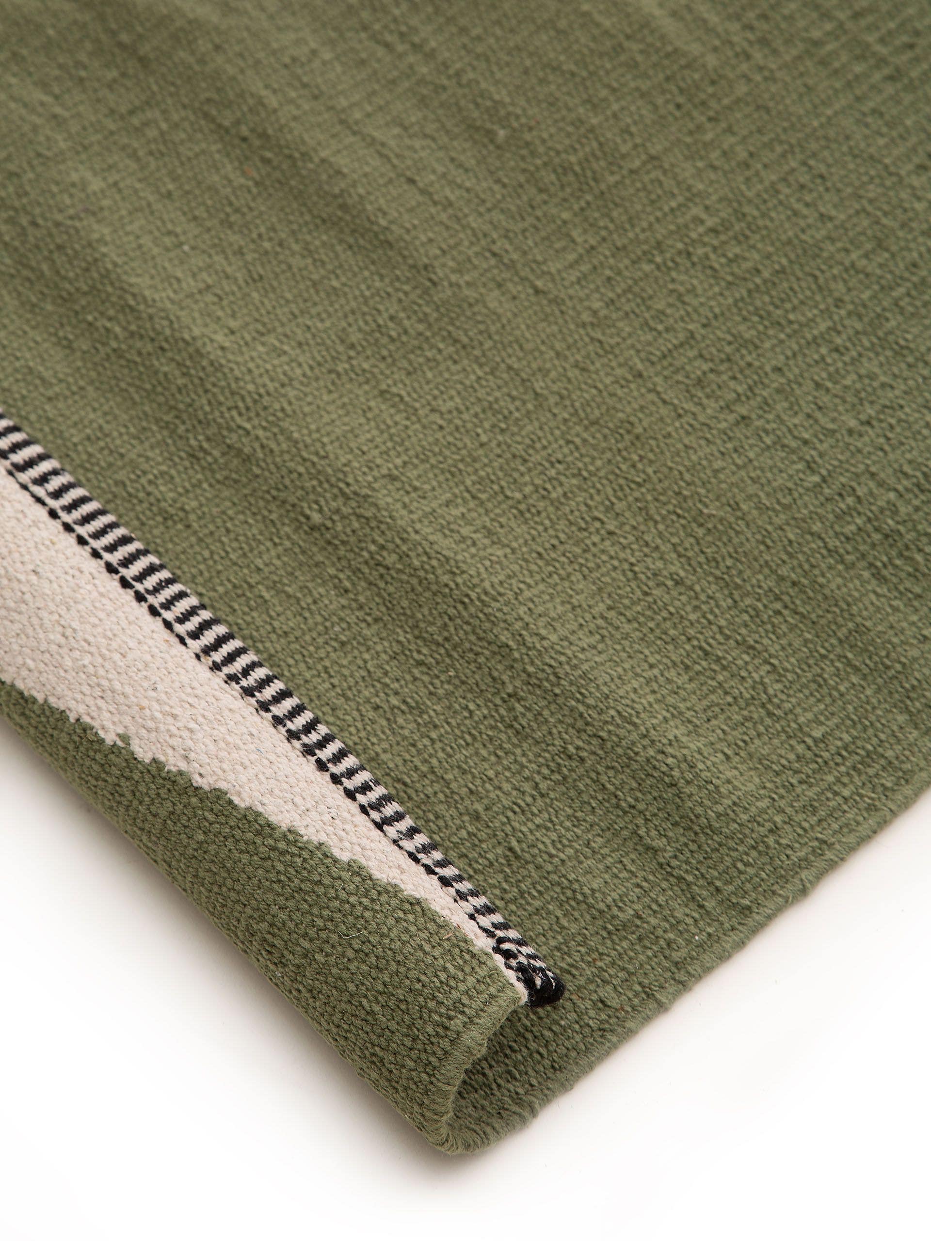 Rug made of 100% Cotton in Green with a 1- 5 mm high pile by benuta Pop