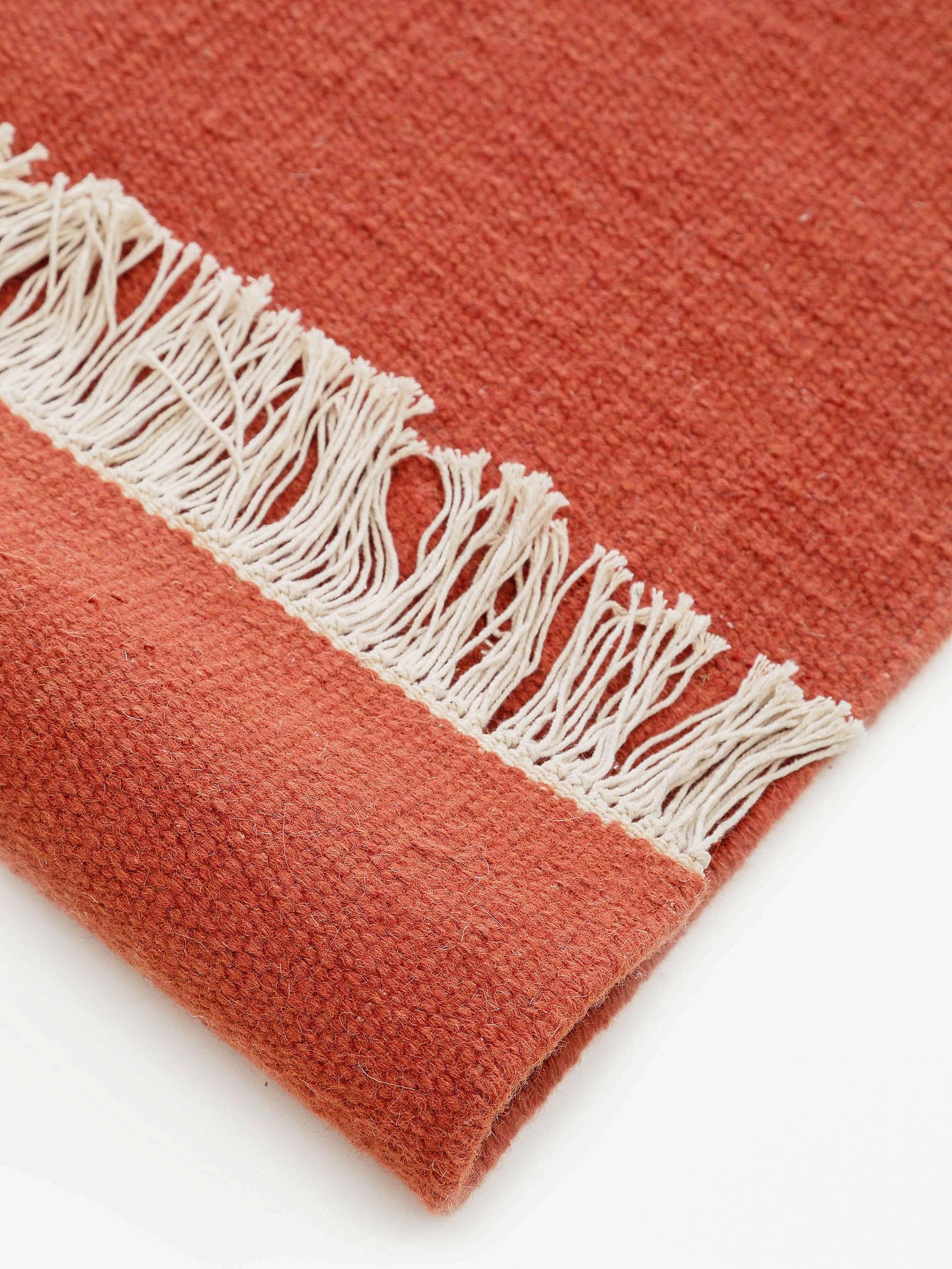 Rug made of 80% wool, 20% cotton in Orange with a 1- 5 mm high pile by benuta Pop