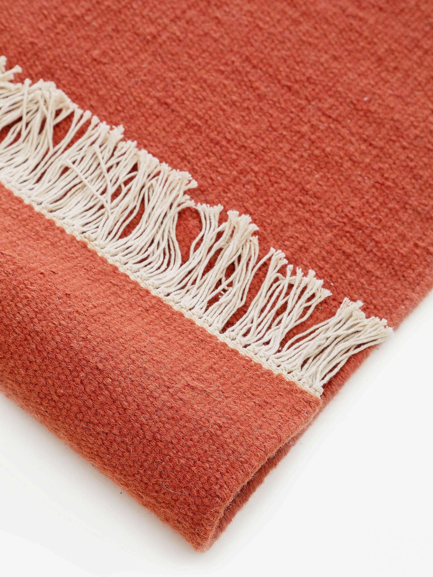 Teppich aus 80% Wolle, 20% Baumwolle in Orange mit bis 5 mm hohem Flor von benuta Pop