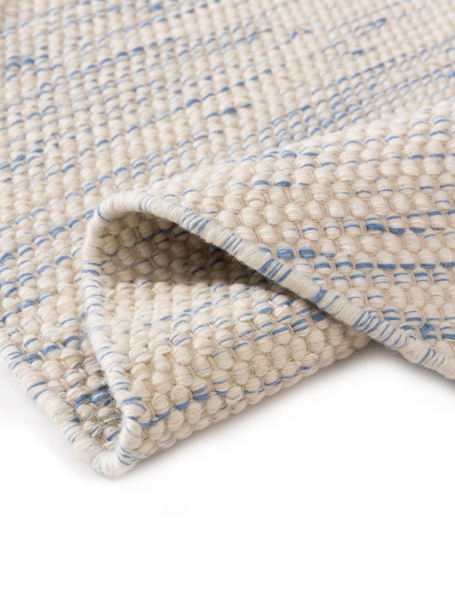 Teppich aus 100% Wolle (aus Neuseeland) in Blau mit bis 5 mm hohem Flor von Lytte