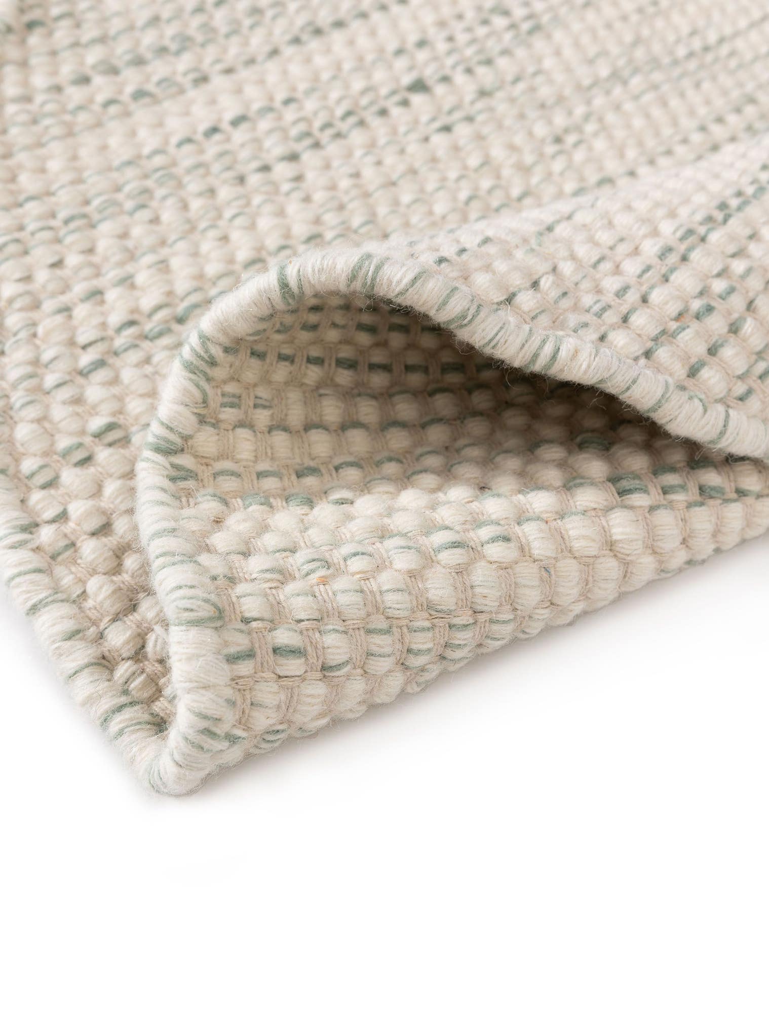 Teppich aus 100% Wolle (aus Neuseeland) in Grün mit bis 5 mm hohem Flor von Lytte