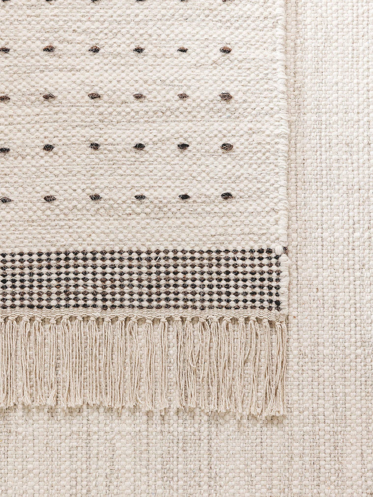 Rug made of 70% Wool, 30% Cotton in Black/White with a 1- 5 mm high pile by benuta Pop