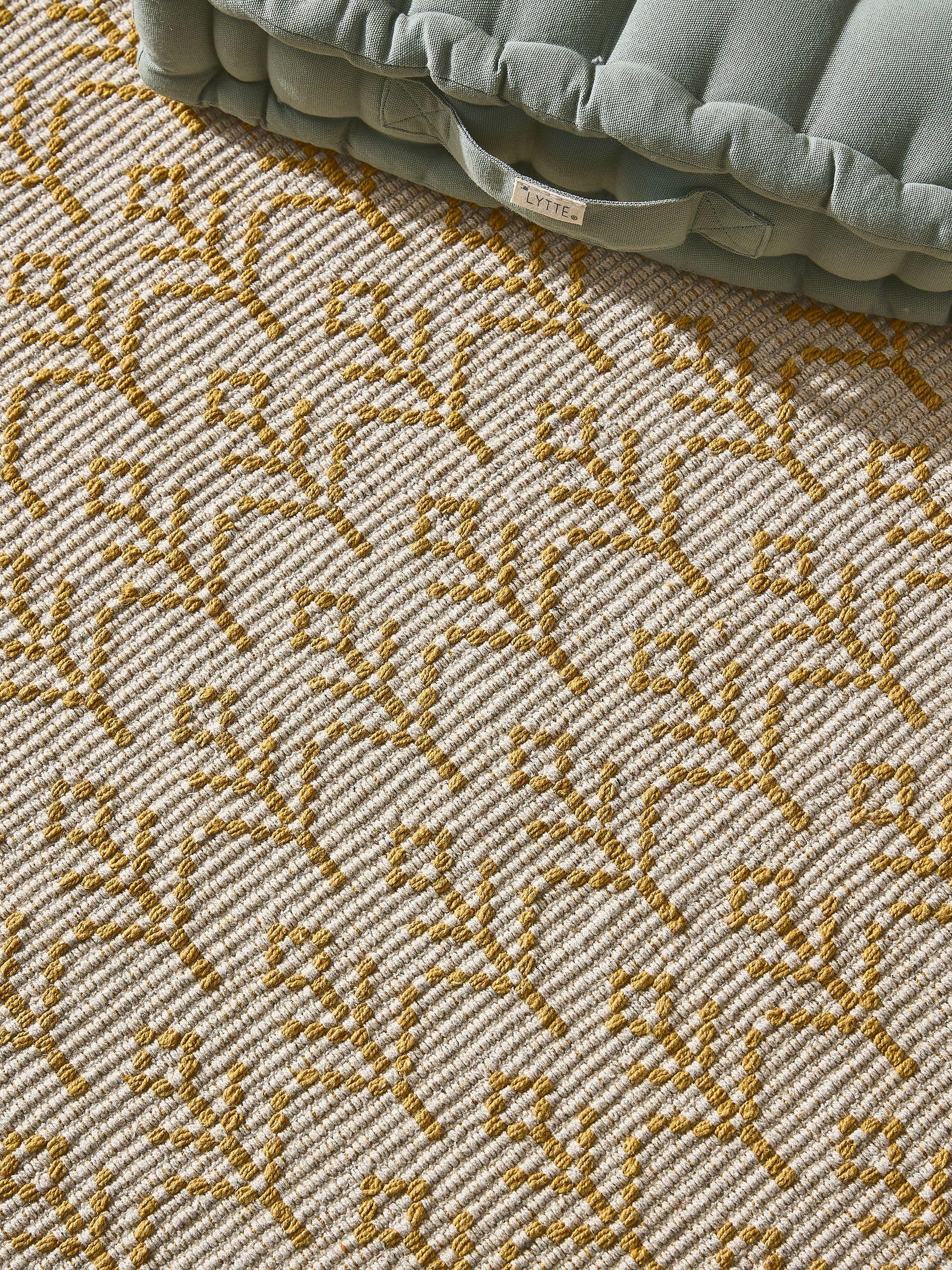 Rug made of 60% Cotton (recycled), 40 % Polyester in Yellow with a 6 - 10 mm high pile by Lytte