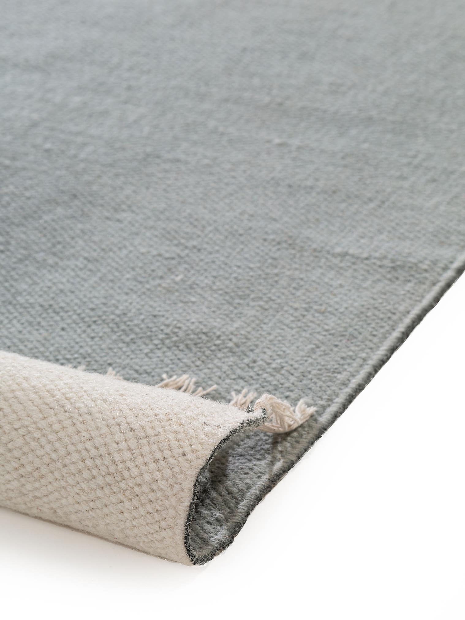 Teppich aus 100% Wolle in Grün mit bis 5 mm hohem Flor von benuta Pop