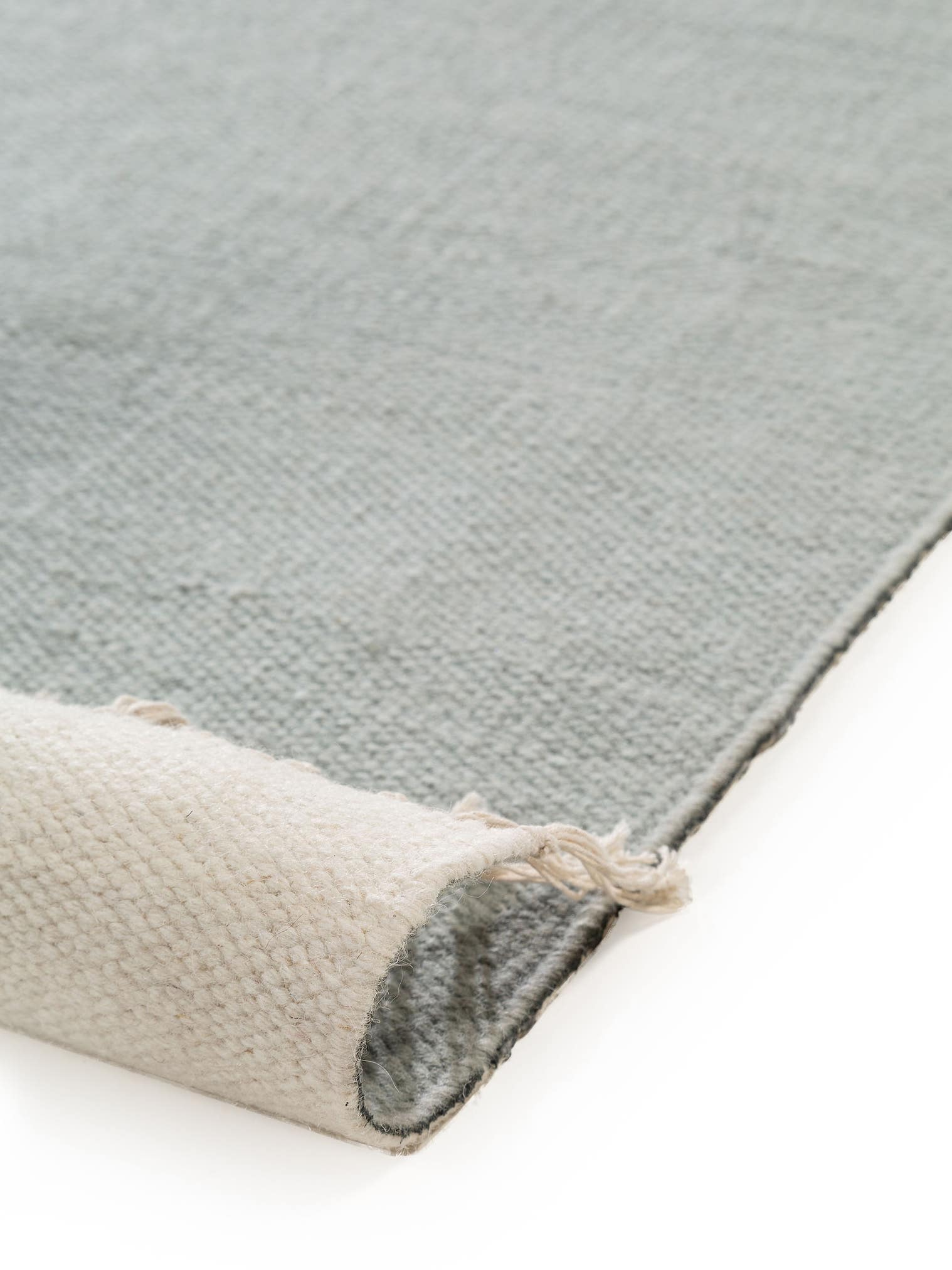 Teppich aus 100% Wolle in Grün mit bis 5 mm hohem Flor von benuta