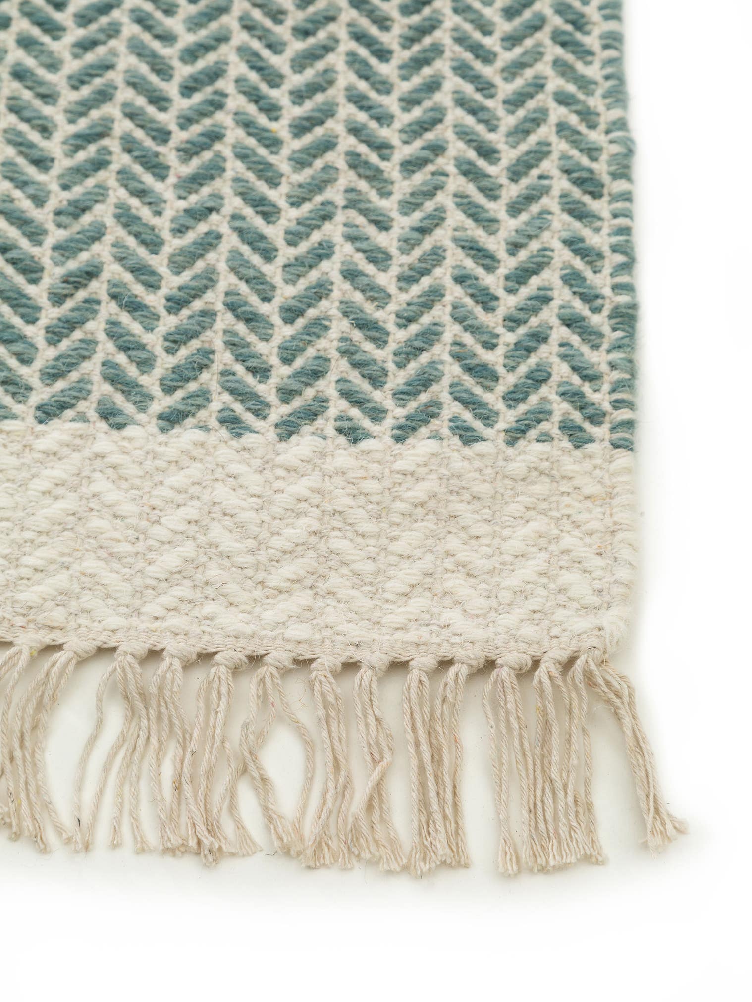 Teppich aus 60% Wolle, 40% Baumwolle in Grün mit bis 5 mm hohem Flor von benuta Pure